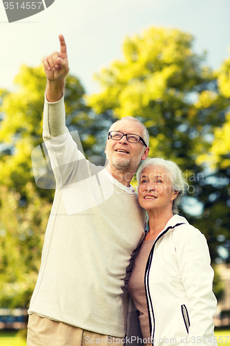 Image of senior couple hugging in park