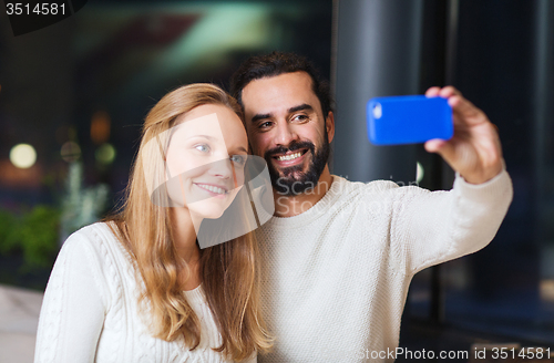 Image of happy couple with tablet pc and coffee at cafe