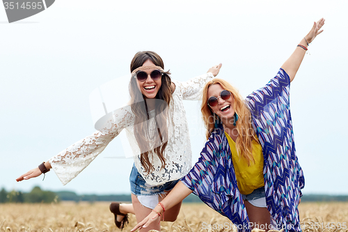 Image of happy hippie women having fun on cereal field