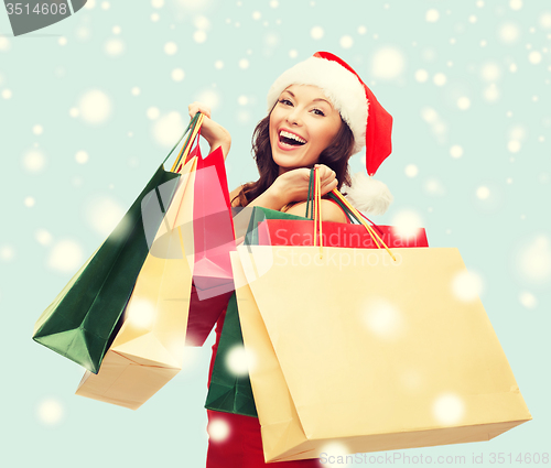 Image of woman in red dress with shopping bags