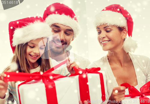 Image of happy family sitting on couch at home