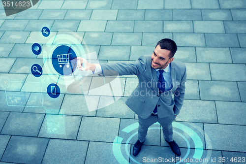 Image of young smiling businessman outdoors from top