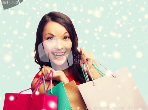 Image of woman in red dress with shopping bags