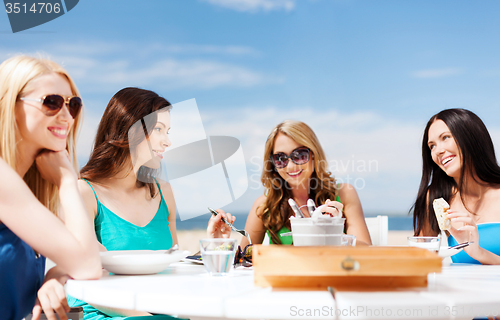 Image of girls in cafe on the beach