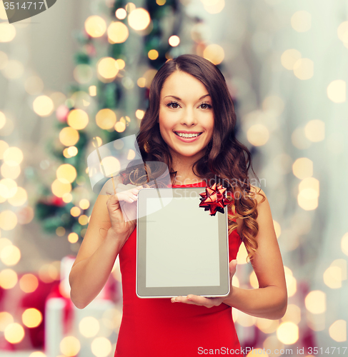 Image of smiling woman with tablet pc