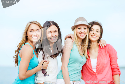 Image of group of girls chilling on the beach