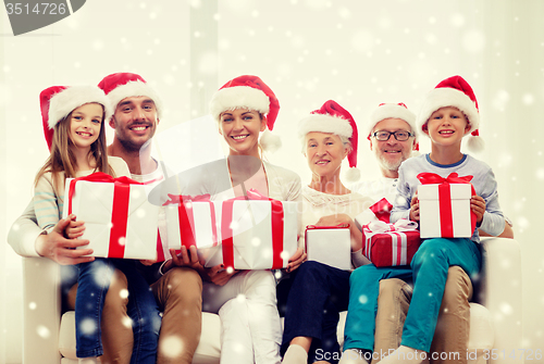 Image of happy family sitting on couch at home