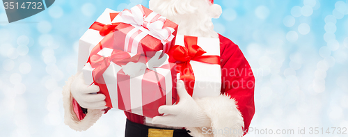 Image of close up of santa claus with gift box