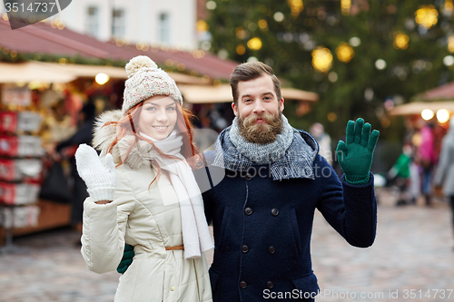 Image of happy couple walking in old town