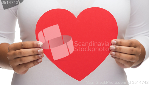 Image of closeup of woman hands with heart