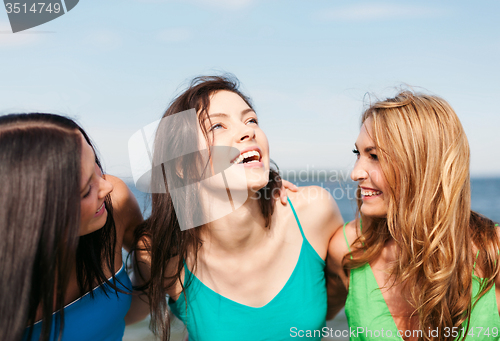 Image of girls walking on the beach