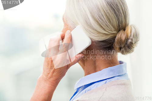 Image of close up of senior woman calling on smartphone