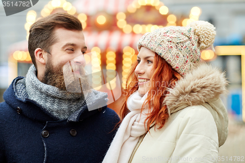 Image of happy couple walking in old town