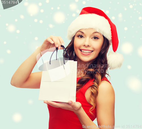 Image of woman in red dress with shopping bag