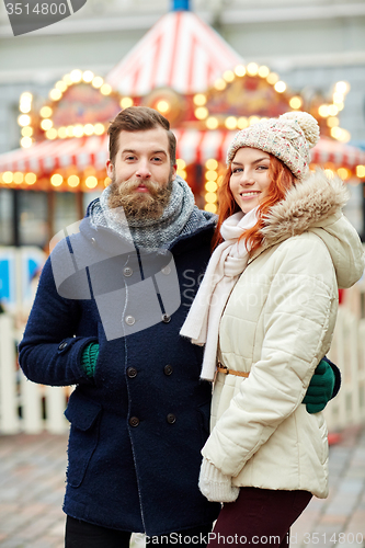 Image of happy couple walking in old town