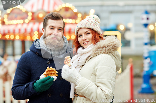 Image of happy couple walking in old town