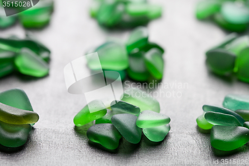 Image of  green pieces of glass polished by the sea 