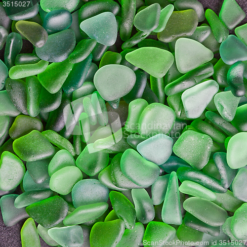 Image of green pieces of glass polished by the sea