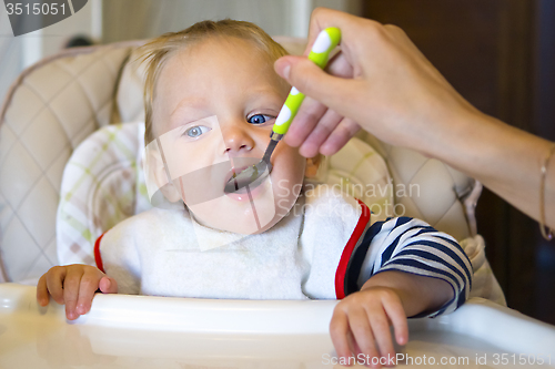 Image of Feeding baby with a spoon