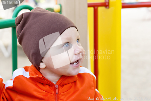 Image of One year boy smiling portrait outside