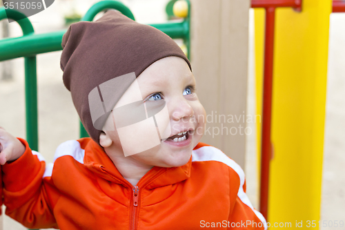 Image of Little boy smiling portrait outside