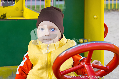 Image of One year old boy at the wheel