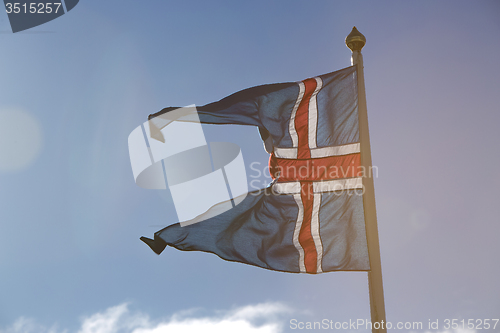 Image of Icelandic national flag in the wind