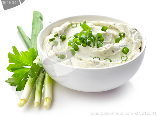 Image of cream cheese with green onions and herbs