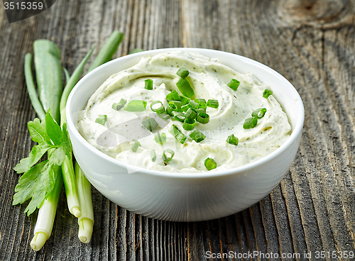 Image of cream cheese with green onions and herbs