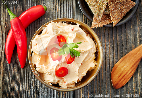 Image of cream cheese with chili and tomato, dip sauce