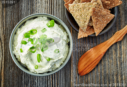 Image of cream cheese with green onions and herbs