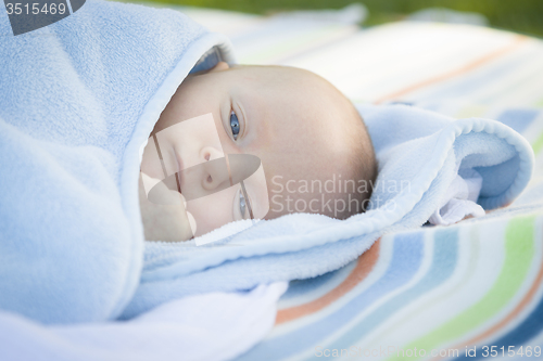 Image of Little Baby Boy Resting in His Warm Blanket