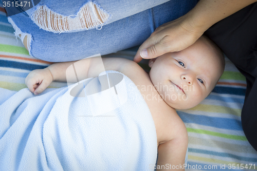 Image of Little Baby Boy Wrapped In His Blanket Resting With Mommy