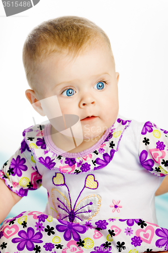 Image of blue-eyed baby girl. Portrait. Close-up
