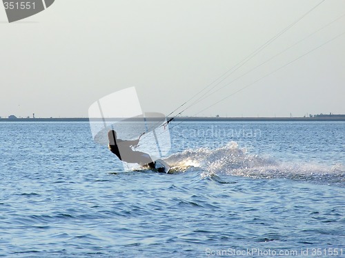 Image of Silhouette of a kite-surf on waves of a gulf 2