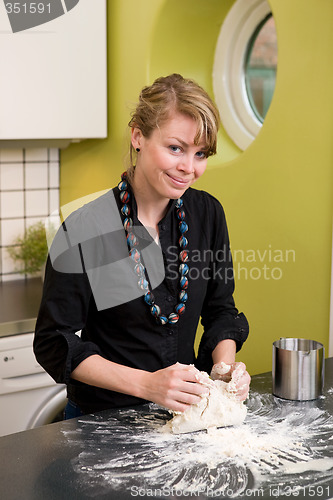 Image of Woman Kneading Dough at Home