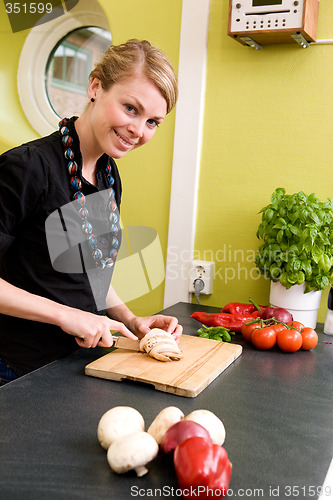 Image of Woman Cutting Vegetables