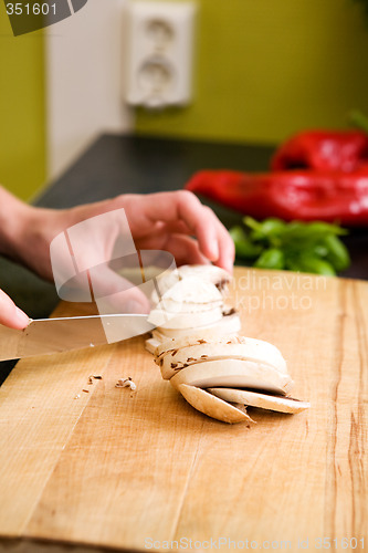 Image of Female Slicing Mushrooms