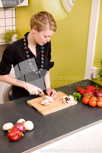 Image of Woman Cutting Vegetables