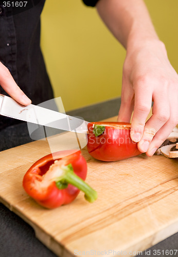 Image of Female Slicing a Red Pepper