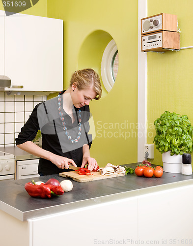 Image of Woman Cutting Vegetables