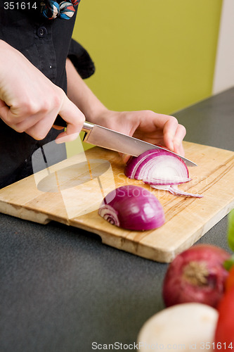 Image of Woman Cutting an Onion