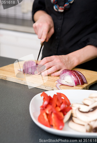 Image of Woman Slicing a Red Onion