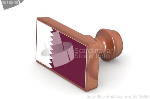 Image of Wooden stamp with Qatar flag