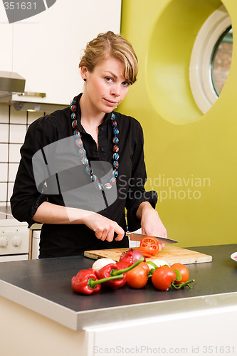 Image of Female Cutting Tomatoes