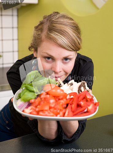 Image of Female Offering Vegetables