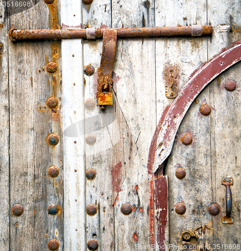 Image of rusty  brown    morocco in africa the old wood  facade home and 