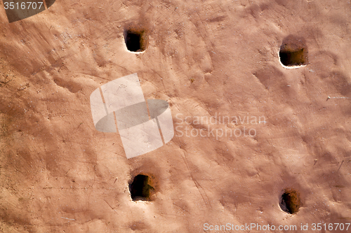Image of brown hole   in texture wall and  morocco  