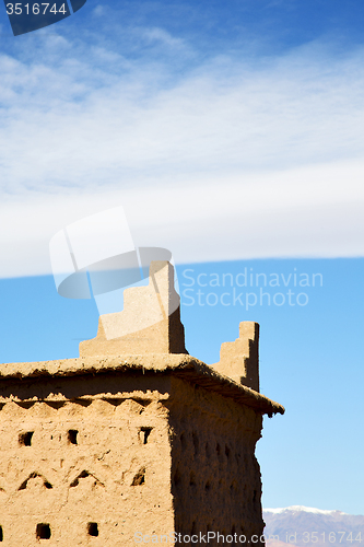 Image of brown old  construction in  africa morocco and  clouds  near the