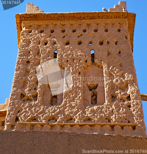 Image of brown old  construction in  africa morocco and  clouds  near the